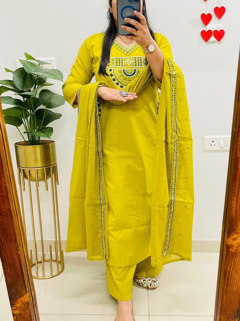 Yellow cotton kurta, pant, and dupatta set with embroidery work