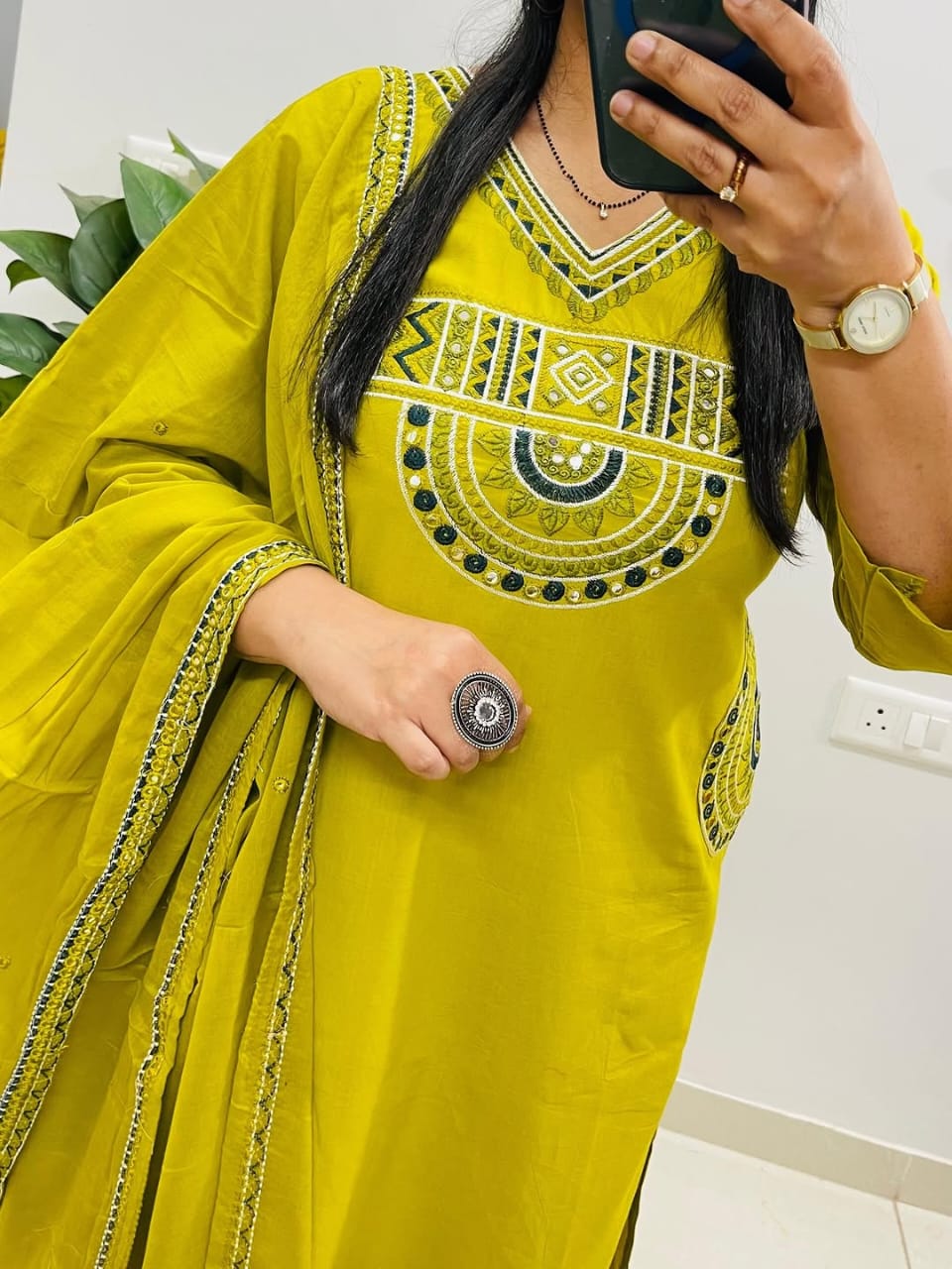 Yellow cotton kurta, pant, and dupatta set with embroidery work