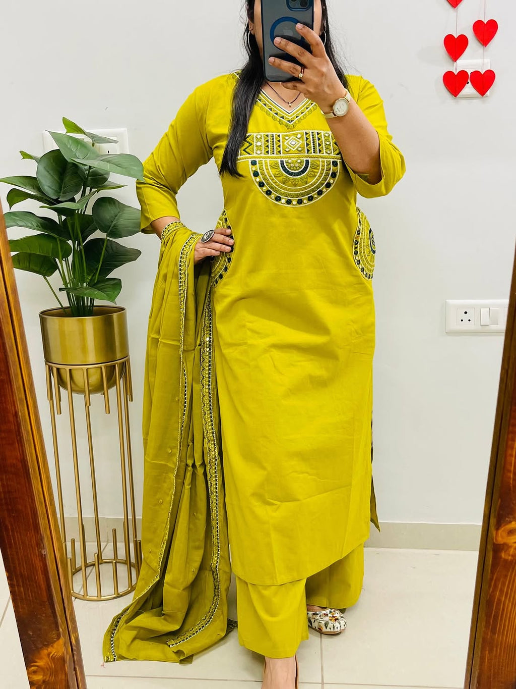 Yellow cotton kurta, pant, and dupatta set with embroidery work
