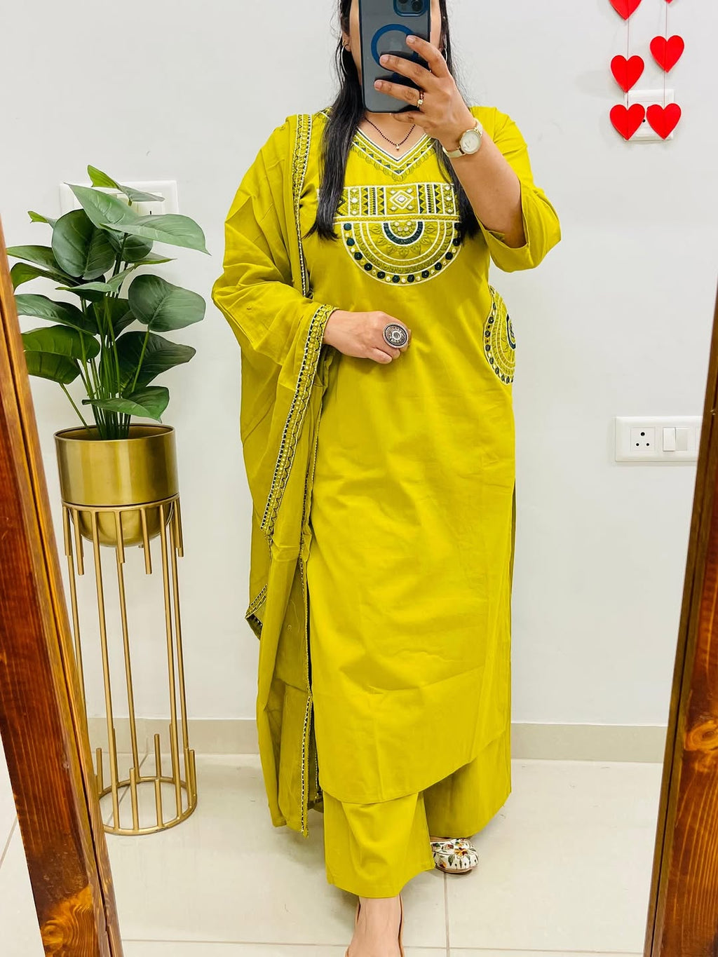 Yellow cotton kurta, pant, and dupatta set with embroidery work
