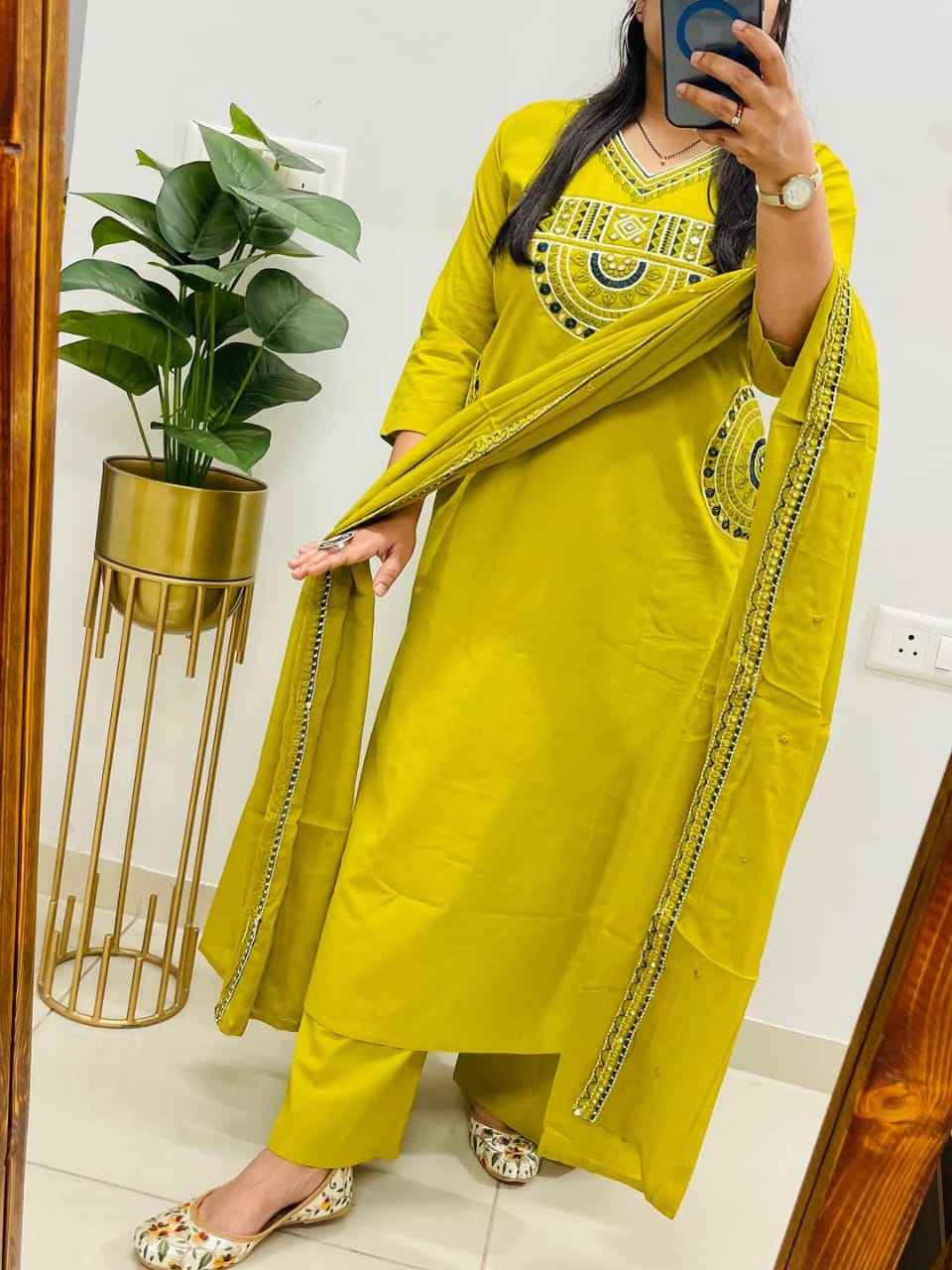 Yellow cotton kurta, pant, and dupatta set with embroidery work