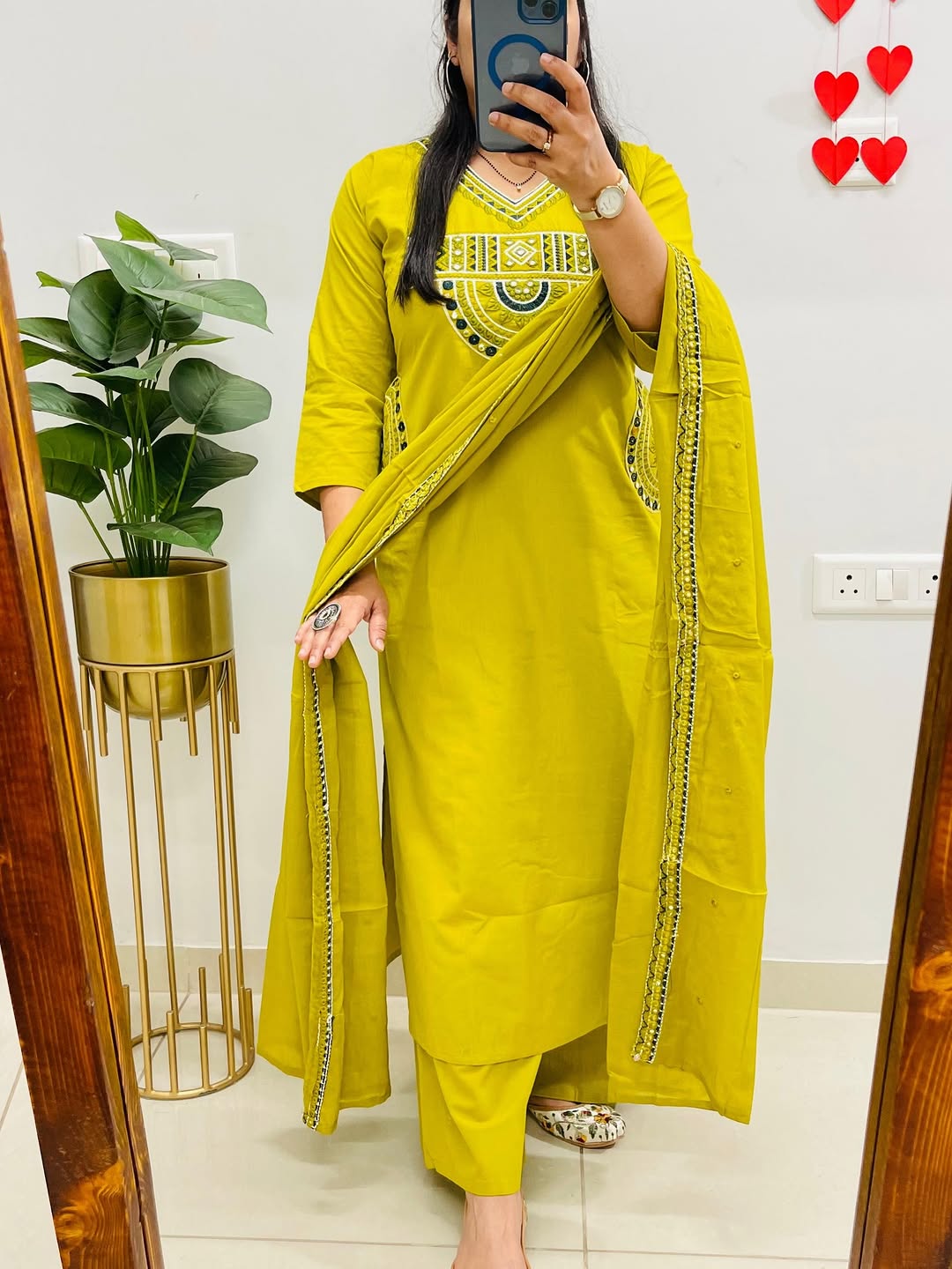 Yellow cotton kurta, pant, and dupatta set with embroidery work